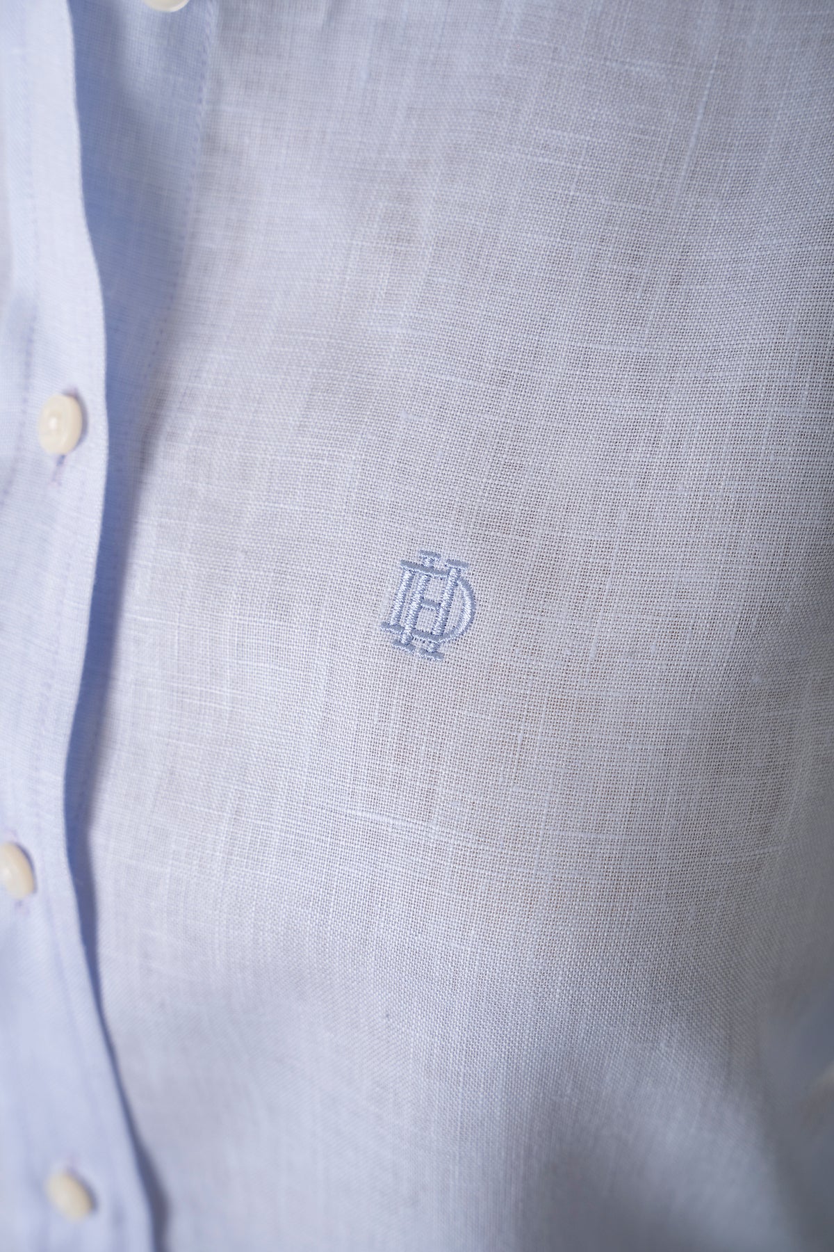 Linen blouse in pastel blue, back view