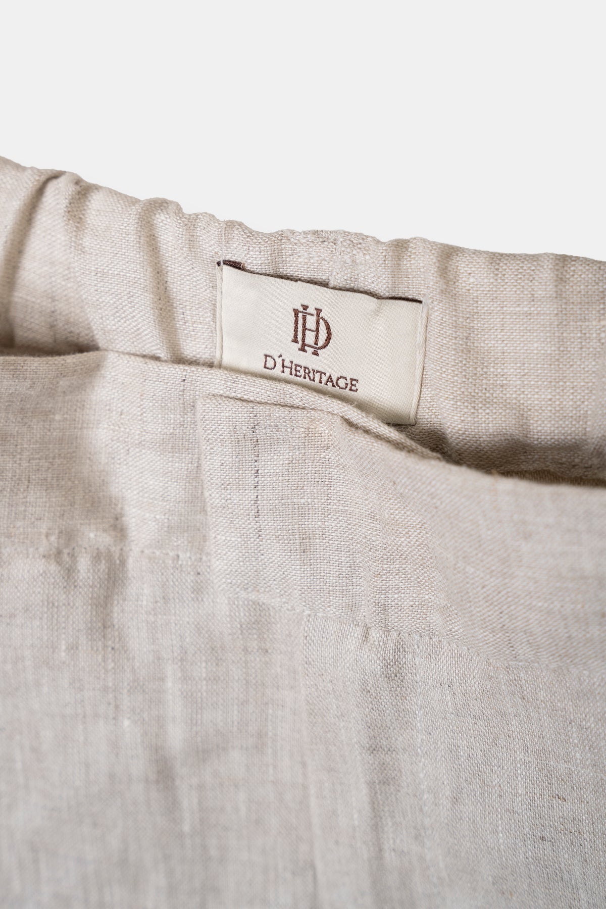 Women’s linen trousers in beige, back view