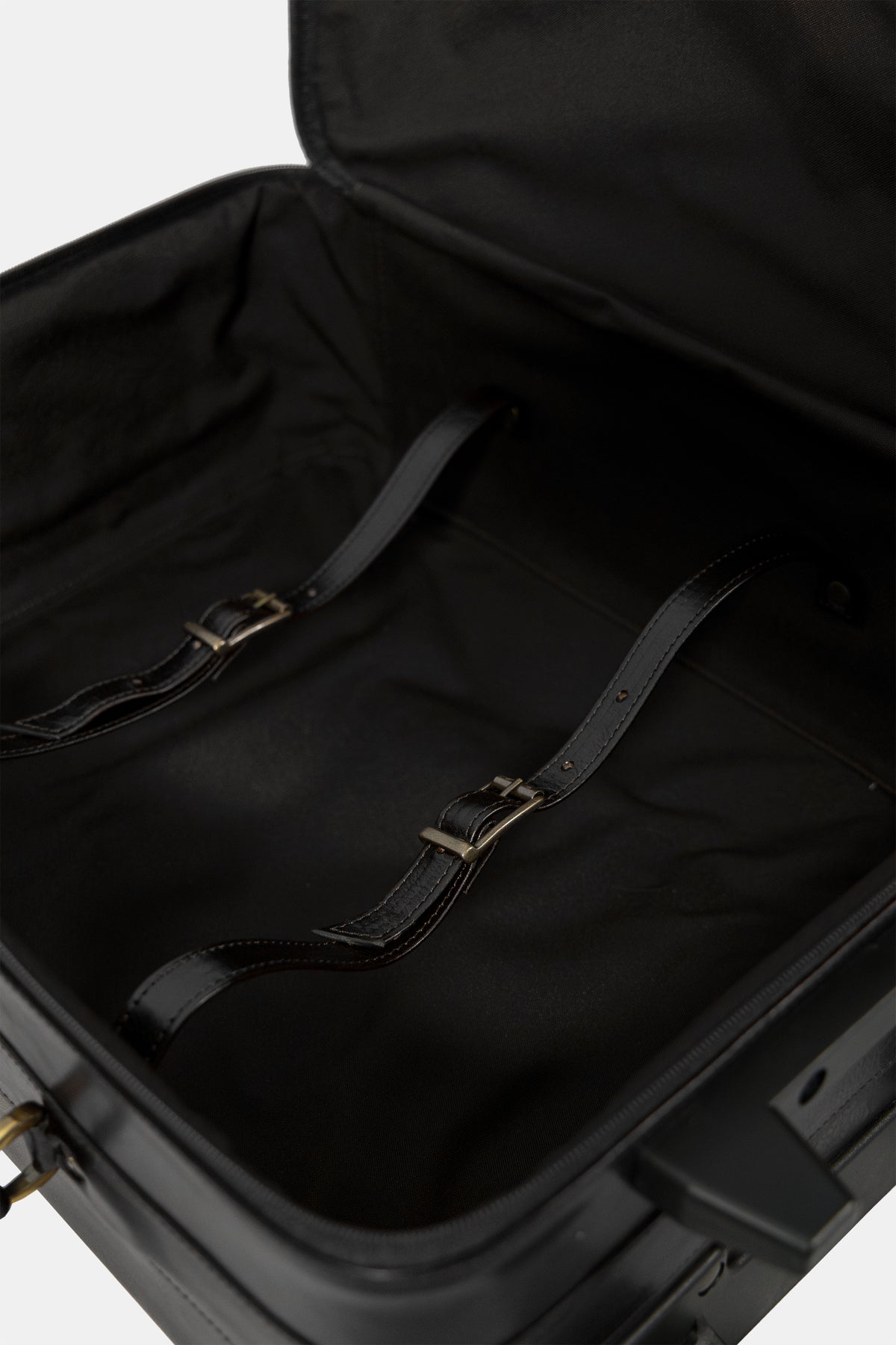 Leather travel trolley in black, wheel and stitching detail
