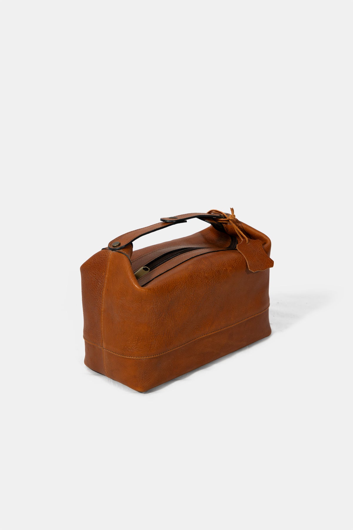 Leather wash bag in brown, side view