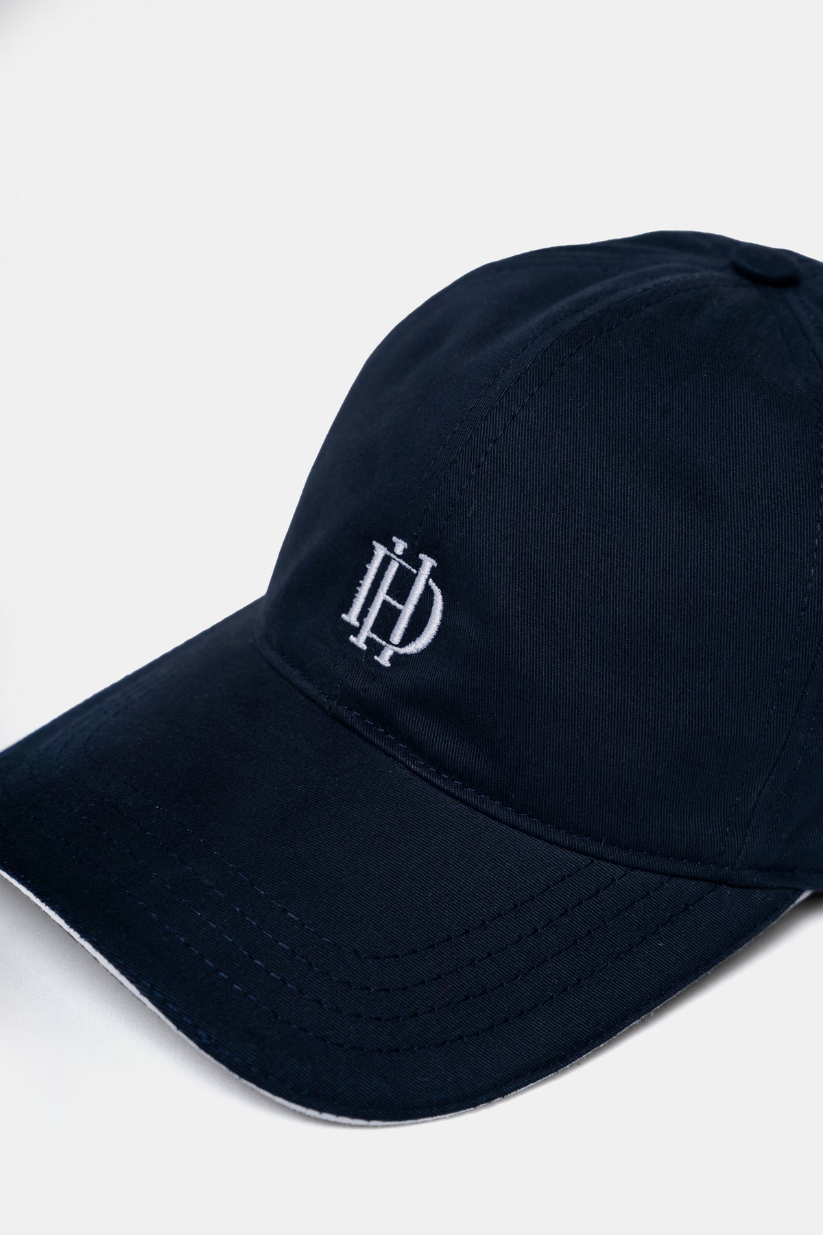 Cotton cap in blue, back view with adjustable strap