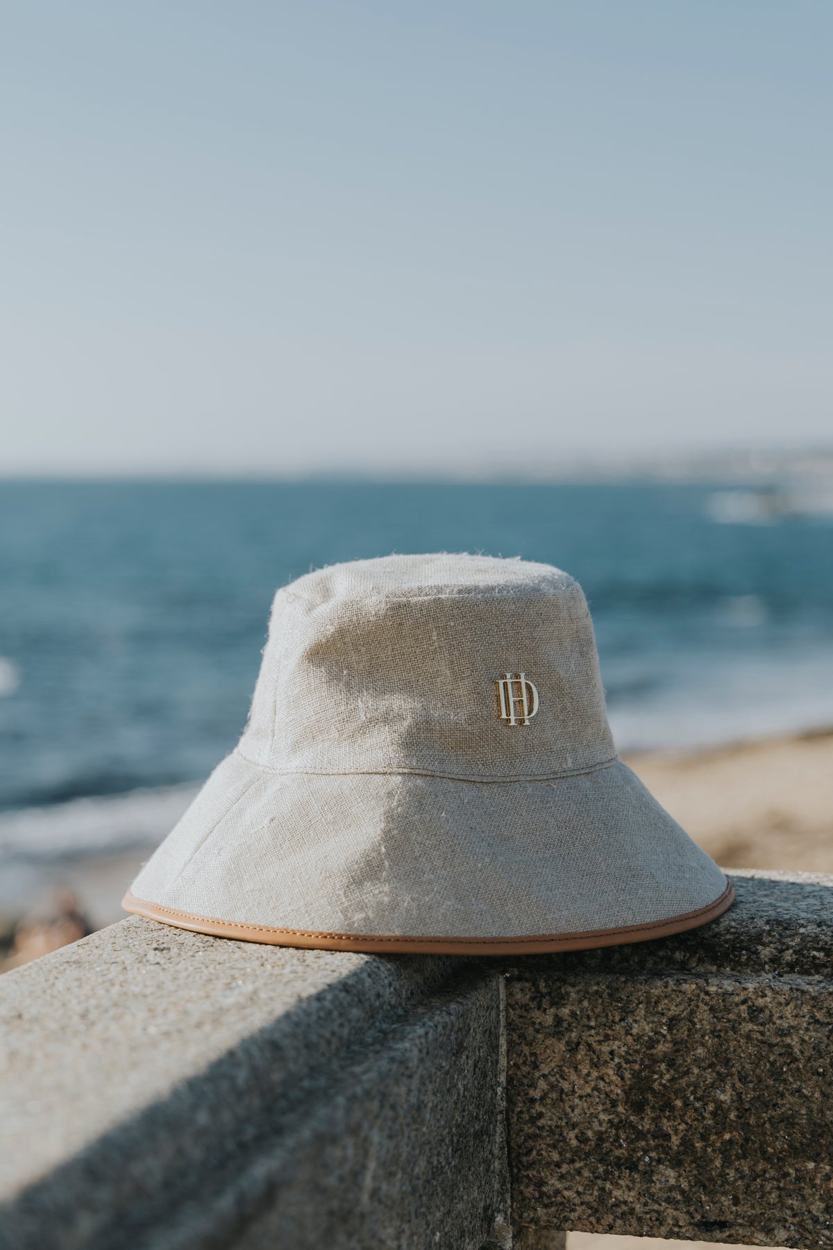 Linen hat worn on the coast, D'Heritage Summer 2026