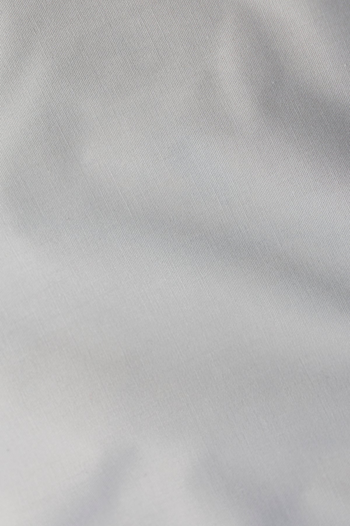 Close-up of the Aviation Essential Line shirt fabric, 58% organic cotton, 39% recycled polyester and 3% elastane at 128 g/m²