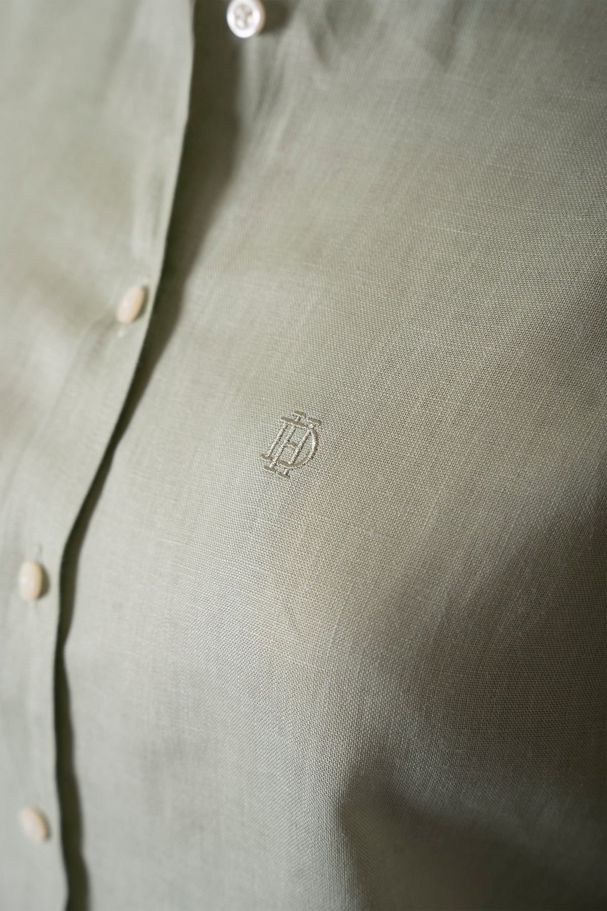 Linen blouse in sage green, back view