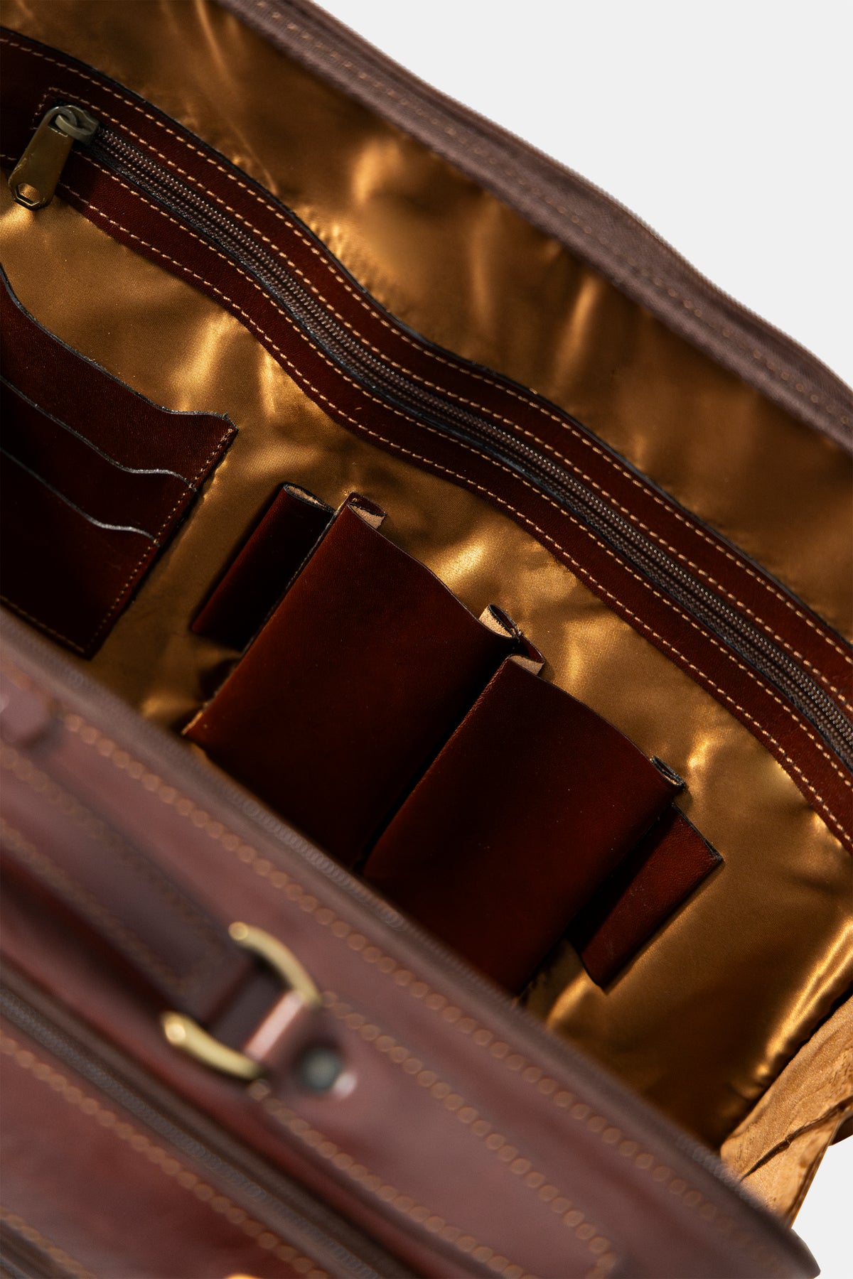 Leather trolley business bag in brown, back view with trolley sleeve