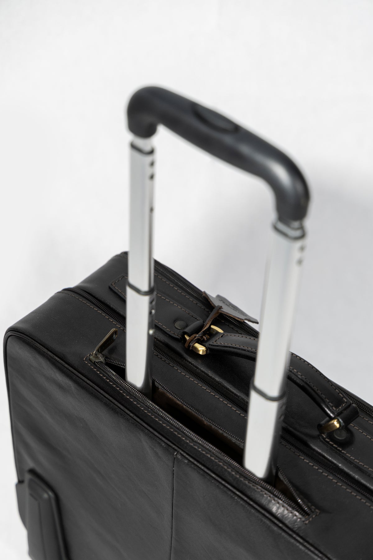 Leather trolley business bag in black, interior compartments