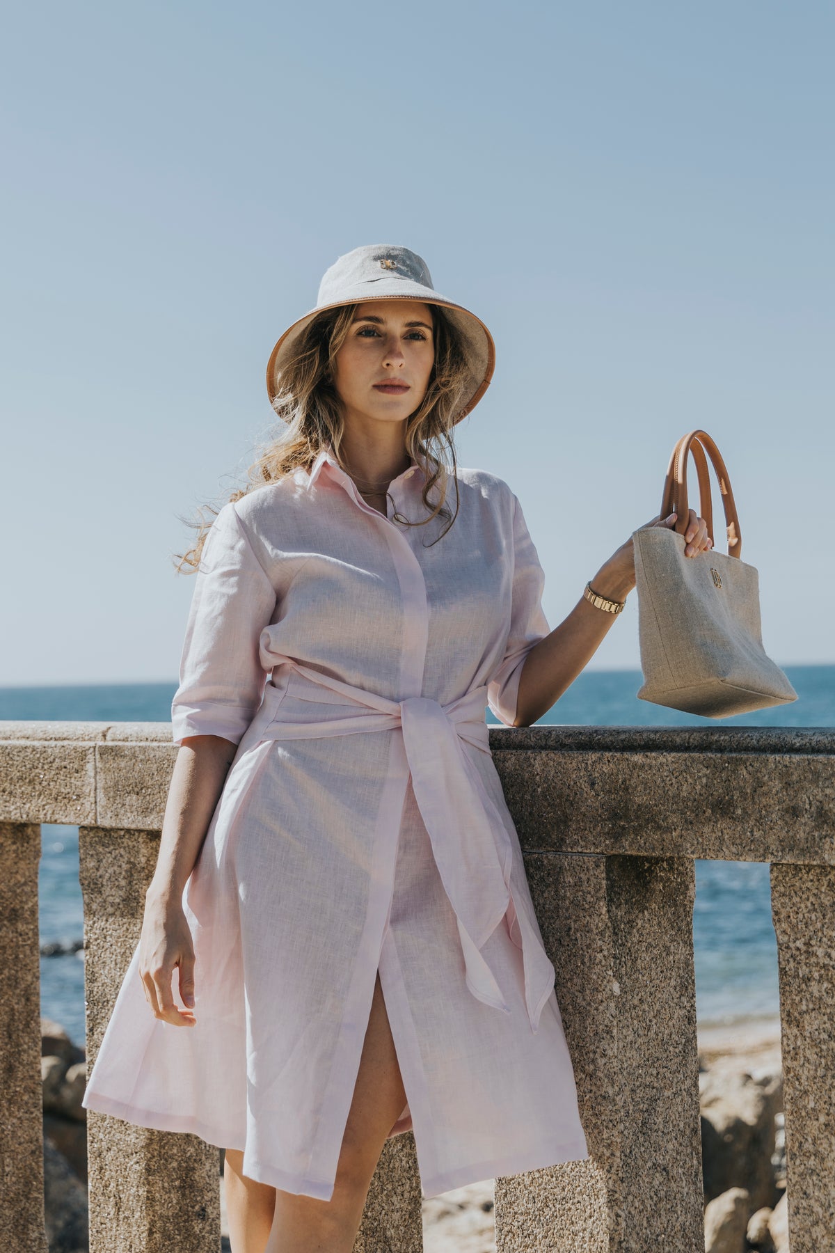 Linen shirt dress worn with a linen hat, D’Heritage Summer 2026